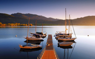 Lake dock boats mountains sunset - several boat free wallpaper