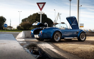 Blue sports car hood open 3 - a street sign free wallpaper