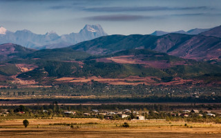 Mountain town cityscape sunset clouds - a view of a mountain range free wallpaper