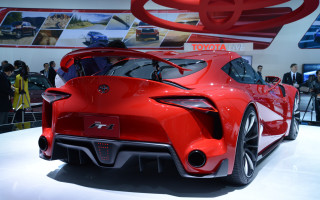 Red sports car display ai - a car show free wallpaper