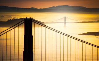 Bridge yellow sky boat mountains - the water below free wallpaper
