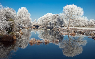 Snowy lake bridge impressionist winter - a bridge in the background free wallpaper