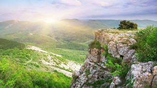 Sunrise valley mountains flower field - a high point of view free wallpaper