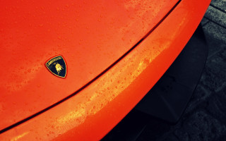 Red car black emblem brick - a red car free wallpaper