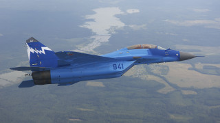Blue fighter jet flying over - aleksandr gerasimov free wallpaper