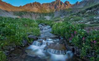 Lush valley mountains flower sunset 2 - a lush green valley free wallpaper