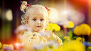 Little girl flowers bokeh portrait - her eye wide open free wallpaper