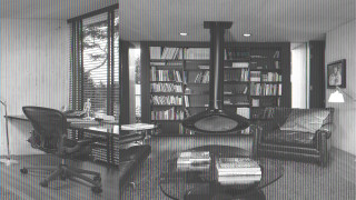 Living room bookshelves chair table - a laptop free wallpaper