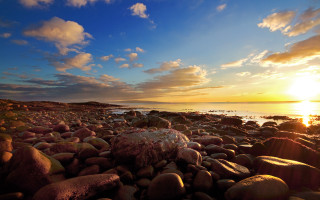 Rocky beach sunset clouds water 2 - wide angle len free wallpaper