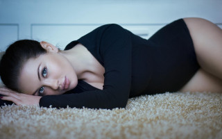 Woman laying black dress heels 2 - a carpet free wallpaper