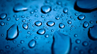 Water droplets blue surface macro 6 - a blue surface free wallpaper for desktop