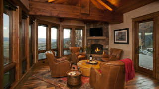 Living room fireplace mountains couch - a fireplace free wallpaper