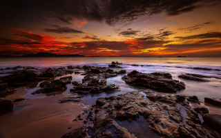 Sunset rocky beach red sky - free beach wallpaper