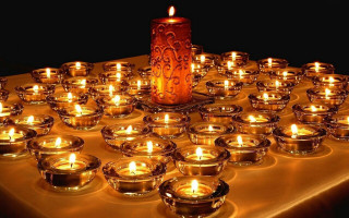 Candle lit table small bowls - a table cloth free wallpaper