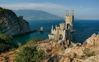 Castle cliff ocean mountains boat - a cliff free wallpaper for desktop