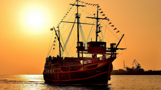 Large boat sunset ocean cloud - a ship in the background free wallpaper