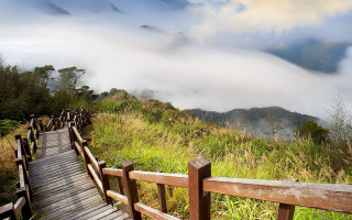 Wooden walkway lush green hillside - free mountains wallpaper