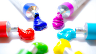 Toothbrushes colorful tube toothpaste action - a white surface free wallpaper for desktop