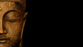 Buddha statue closeup black background 5 - facial feature free wallpaper