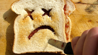 Person cutting bread face knife - realistic free wallpaper