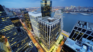 Cityscape tall buildings river night - tall building and a river in the background free wallpaper