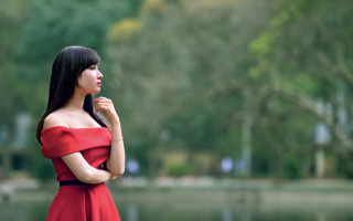 Woman red dress lake portrait - the background and a sky in the background free wallpaper