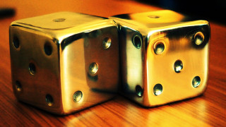 Shiny metal dices wooden table - hole free wallpaper