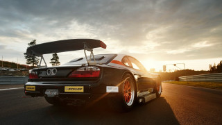 Black car surfboard sunset road - brian dunlop free wallpaper
