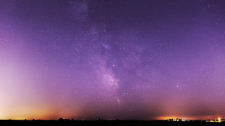 Purple sky stars buildings astronaut - astrophotography free wallpaper