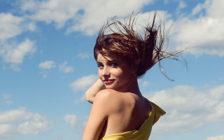 Woman yellow dress waving hair - smiling free wallpaper