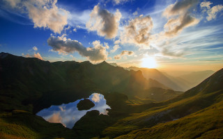 Sunset mountain lake reflection clouds - a reflection of the sun free wallpaper