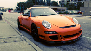 Bright orange sports car city 4 - a parking meter free wallpaper