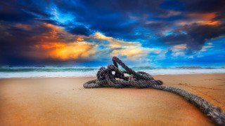 Rope beach sunset clouds lighthouse - a sun setting behind free wallpaper
