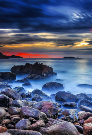 Rocky beach sunset mystical colors 3 - a sunset in the background free wallpaper for mobile
