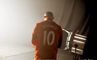 Man orange jacket standing room - orange free wallpaper