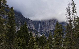 Mountain waterfall trees clouds nature - a waterfall in the middle of it free wallpaper