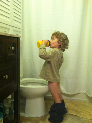 Little girl drinking yellow cup - photography free wallpaper for mobile