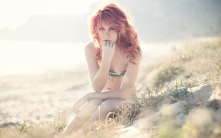 Beach woman redhair bikini sitting - under her chin free wallpaper