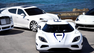 White sports cars ocean pier 2 - a boat in the background free wallpaper
