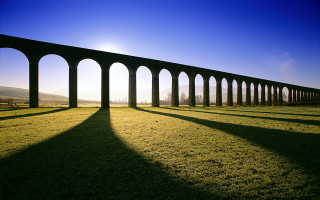 Train shadow precisionism bright sky - a long shadow free wallpaper