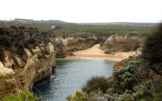 Australian beach cliff water sandscape - a cliff and a body of water free wallpaper for desktop