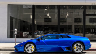 Blue sports car parking meter - the side of the road in front free wallpaper