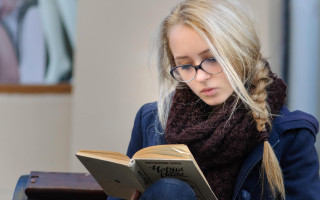 Woman reading scarf suitcase painting - a painting behind her free wallpaper