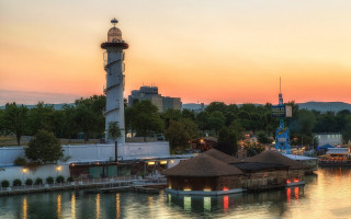 Lighthouse sunset harbor kitsch architecture - a lighthouse free wallpaper