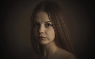 Freckled woman serious portrait artist - hair free wallpaper