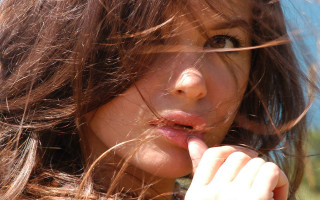 Woman blowing hair cigarette portrait - her mouth free wallpaper