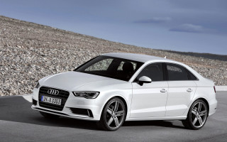 White car hill rocks clouds - a white car free wallpaper