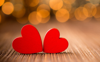 Red hearts wooden table bokeh - two red heart free wallpaper