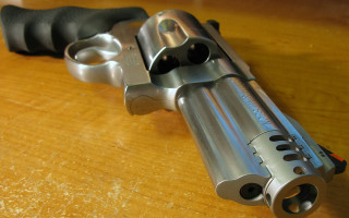 Gun metal barrel black grips - plastic free wallpaper