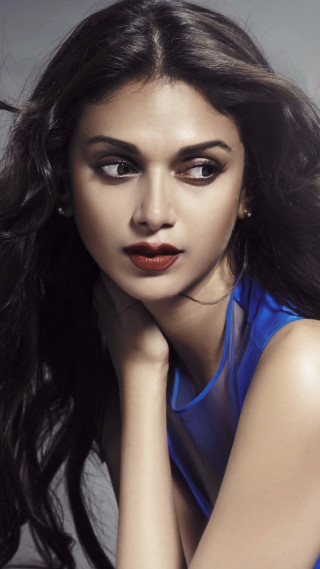 Woman long hair blue top 2 - a blue top free wallpaper for mobile